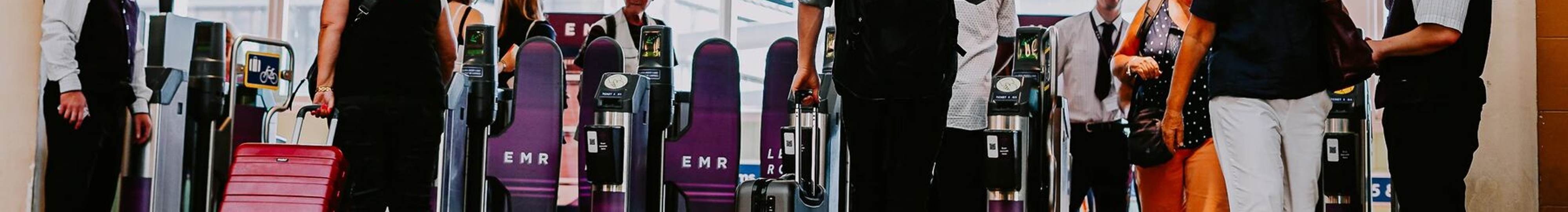 EMR Stations Nottingham Station - Passengers with suitcases walking through gateline - Web Homepage Takeover.jpg