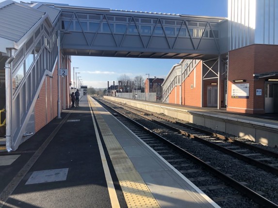 Image showing the view southbound from Platform 2 at Market Harborough, view includes the new station overbridge and lifts, as well as an extended platform 2. 
