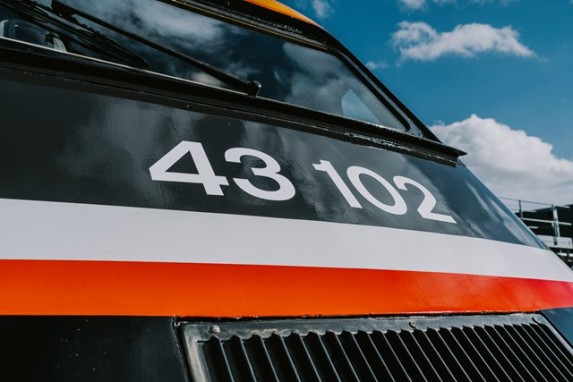 Image showing HST 43102 in original livery, freshly painted. This view shows the front of the engine as a close up on the vehicle number which has been reverted back to it's original 43102.