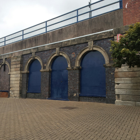 An image of the 3 railway arches which will be decorated with Adrian's mural.