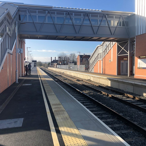 Image showing the view southbound from Platform 2 at Market Harborough, view includes the new station overbridge and lifts, as well as an extended platform 2. 