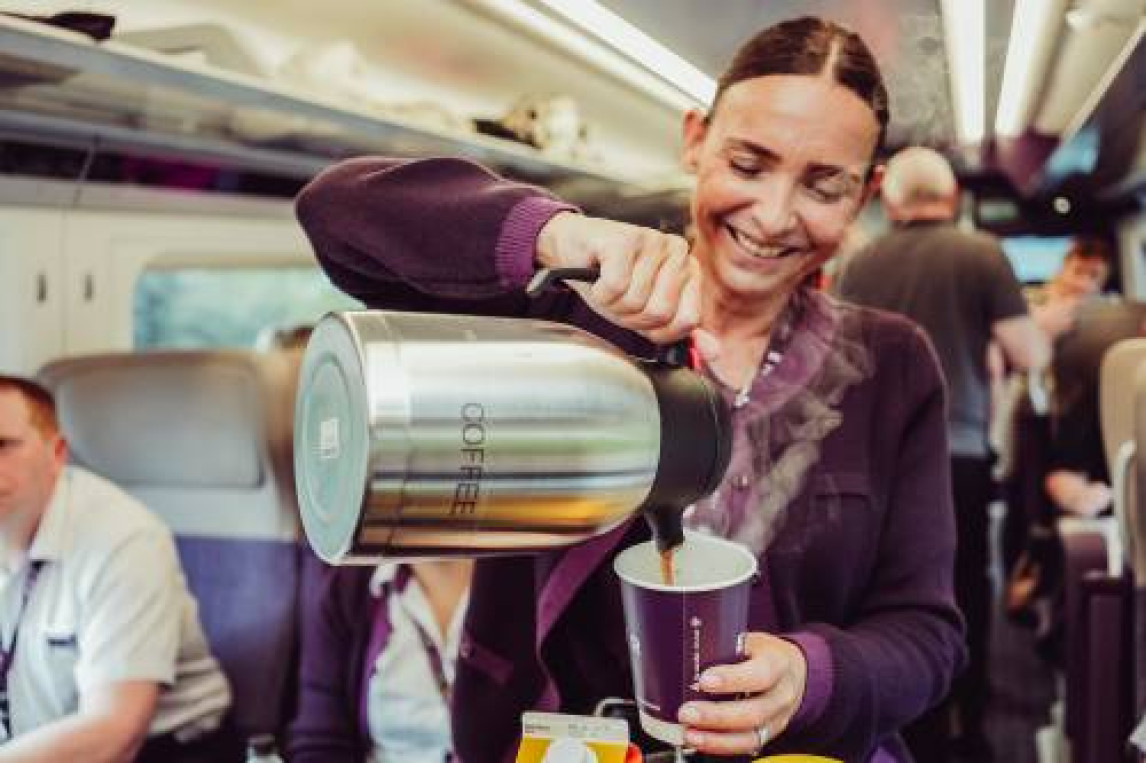 Pouring coffee in first class